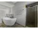 Bathroom boasts a large, free-standing tub and a glass shower at 7077 E Mulberry St, Gwynneville, IN 46144