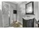 Bathroom with shower, vanity, and a small mirror at 7077 E Mulberry St, Gwynneville, IN 46144