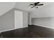 Bedroom with dark wood floors and double closets at 7077 E Mulberry St, Gwynneville, IN 46144