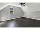Bright bedroom with dark wood floors and a ceiling fan at 7077 E Mulberry St, Gwynneville, IN 46144