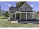 Charming gray house with a metal roof and front porch at 7077 E Mulberry St, Gwynneville, IN 46144