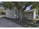 Side view of the house showing detached garage and large tree at 7077 E Mulberry St, Gwynneville, IN 46144