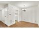 Simple dining area with wood floors and kitchen access at 7368 Countrybrook Dr # 7368, Indianapolis, IN 46260