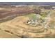 Expansive aerial view of a new construction community featuring homes, ponds, green spaces, and surrounding landscape at 7541 Big Bend Blvd, Camby, IN 46113