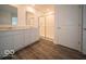 Modern bathroom with double vanity, white cabinets, and a glass-enclosed shower stall at 7541 Big Bend Blvd, Camby, IN 46113