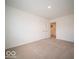 Carpeted bedroom with an open double door leading to a closet, perfect for storage at 7541 Big Bend Blvd, Camby, IN 46113
