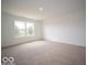 Spacious bedroom with a large window bringing in plenty of natural light and neutral carpet at 7541 Big Bend Blvd, Camby, IN 46113