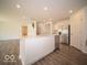 Bright kitchen with stainless steel appliances, a center island, and an open floor plan at 7541 Big Bend Blvd, Camby, IN 46113