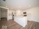Spacious kitchen with white cabinets, stainless steel appliances, and a large center island at 7541 Big Bend Blvd, Camby, IN 46113
