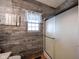 Bathroom with shower and rustic wood-paneled walls at 7675 E 500 N, Lebanon, IN 46052