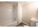 Clean bathroom with a shower/tub combo and neutral tile at 836 S Tremont St, Indianapolis, IN 46221