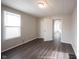 Bright bedroom with vinyl flooring and access to another room at 836 S Tremont St, Indianapolis, IN 46221