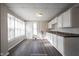 Bright eat-in kitchen with white cabinets and vinyl flooring at 836 S Tremont St, Indianapolis, IN 46221