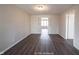 Simple living room with hardwood floors and neutral walls at 836 S Tremont St, Indianapolis, IN 46221