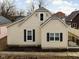 Tan house exterior with dark shutters and a dormer window at 85 E Poplar St, Zionsville, IN 46077