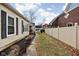 Landscaped side yard with walkway at 85 E Poplar St, Zionsville, IN 46077