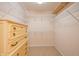 Walk-in closet with wire shelving and dresser at 879 Gazebo Way, Greenwood, IN 46142