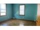 Empty bedroom with hardwood floors and two windows at 901 W Marsh St, Muncie, IN 47303