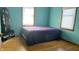 Bedroom with hardwood floors and a double bed at 901 W Marsh St, Muncie, IN 47303