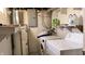 Basement laundry room with washer, dryer, and water heater at 901 W Marsh St, Muncie, IN 47303