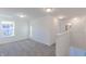 Spacious bedroom with grey carpet and window views at 902 Stonehaven Dr, Indianapolis, IN 46239