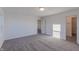 Bright bedroom with carpet flooring and walk-in closet at 902 Stonehaven Dr, Indianapolis, IN 46239