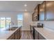 Kitchen with double sink and stainless steel appliances at 902 Stonehaven Dr, Indianapolis, IN 46239