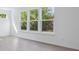 Bright living room featuring large windows and hardwood floors at 902 Stonehaven Dr, Indianapolis, IN 46239