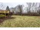 Expansive backyard featuring a wooden deck, mature trees, and plenty of open space at 9229 Thrushwood Ln, Indianapolis, IN 46250