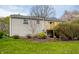 Exterior view of home with a deck, siding, and a lush green backyard at 9229 Thrushwood Ln, Indianapolis, IN 46250