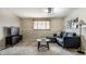 Cozy basement living area with a comfortable couch, stylish coffee table, and sleek entertainment center at 9229 Thrushwood Ln, Indianapolis, IN 46250
