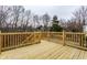 Spacious back deck featuring wooden railings and stairs at 9229 Thrushwood Ln, Indianapolis, IN 46250