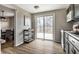 Bright kitchen with sliding glass doors to deck, breakfast nook, and access to dining area at 9229 Thrushwood Ln, Indianapolis, IN 46250