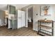 Bright kitchen showcasing green cabinets, a white refrigerator, and a convenient serving cart at 9229 Thrushwood Ln, Indianapolis, IN 46250