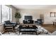 Modern living room featuring dark accents, neutral walls, and large windows for ample natural light at 9229 Thrushwood Ln, Indianapolis, IN 46250