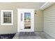 White front door with glass panels and a welcome mat at 934 Farmview Ln, Carmel, IN 46032