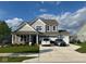 Charming two-story home boasts a three car garage, and a beautifully landscaped front yard, creating curb appeal at 9426 Orchard Cove Dr, Indianapolis, IN 46239