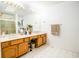 Elegant bathroom boasting a double vanity, large mirror, and shower at 965 Driftwood Ave, Columbus, IN 47203