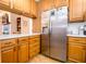 Bright kitchen with oak cabinets, stainless steel appliances, and white countertops at 965 Driftwood Ave, Columbus, IN 47203