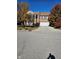 Two-story brick home with attached garage and autumn landscaping at 10370 Splendor Way, Indianapolis, IN 46234