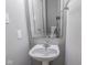 Small bathroom with pedestal sink and mirror at 10391 Butler Dr, Brownsburg, IN 46112