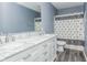 Bathroom with double vanity and shower/tub combo at 10391 Butler Dr, Brownsburg, IN 46112