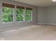 Expansive bedroom with three windows and carpet at 10391 Butler Dr, Brownsburg, IN 46112