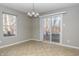 Dining area with tile floor, sliding glass door, and neutral walls at 10391 Butler Dr, Brownsburg, IN 46112