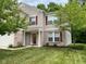 Two-story house with brick and siding, red shutters, and a well-manicured lawn at 10391 Butler Dr, Brownsburg, IN 46112