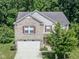 Charming two-story home with a brick facade, attached two-car garage, and nicely landscaped front yard at 10391 Butler Dr, Brownsburg, IN 46112