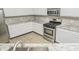 Modern kitchen with white cabinets, granite countertops, and stainless steel appliances at 10391 Butler Dr, Brownsburg, IN 46112