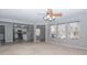 Open living room with kitchen view, neutral walls, and hardwood floors at 10391 Butler Dr, Brownsburg, IN 46112
