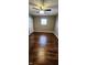 Spacious bedroom with dark hardwood floors and ceiling fan at 11 Eastridge Dr, Greenwood, IN 46143