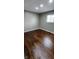 Bright bedroom with dark hardwood floors and neutral walls at 11 Eastridge Dr, Greenwood, IN 46143